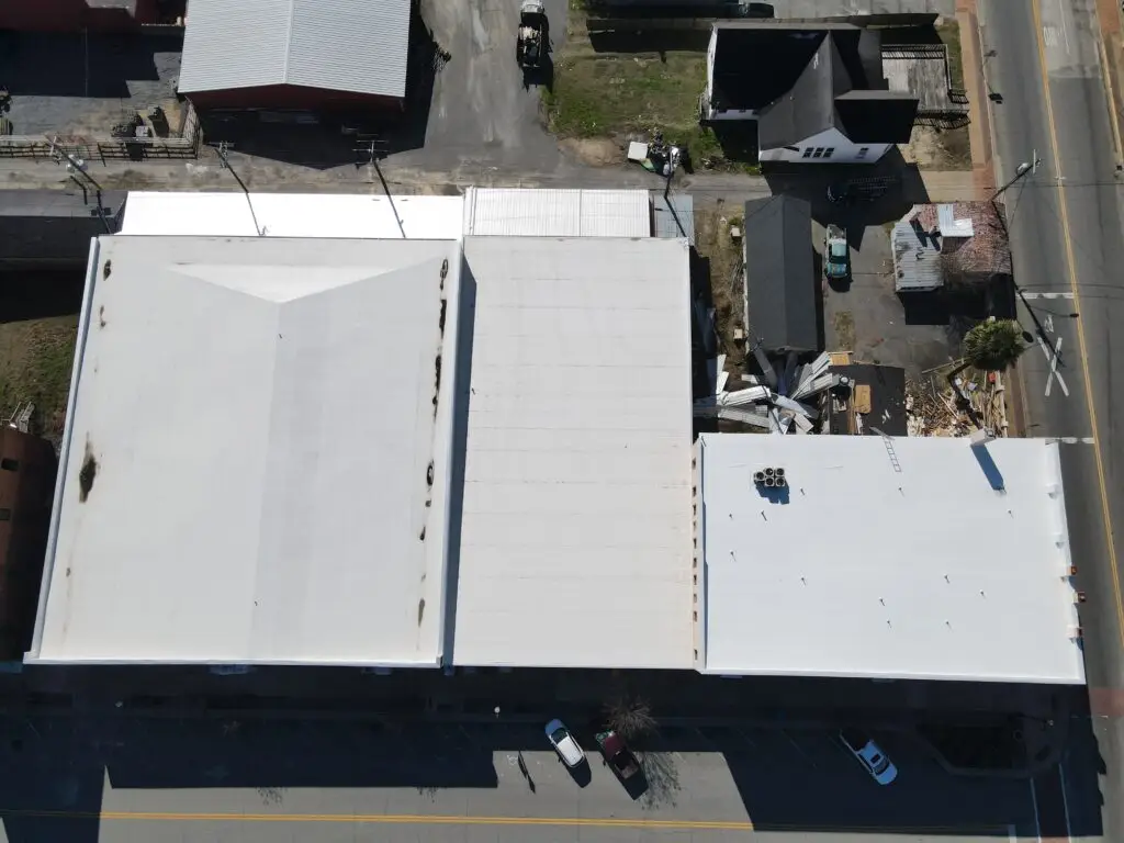 Finished commercial roof aerial view of the Handy Andy store by Olde South Contractors