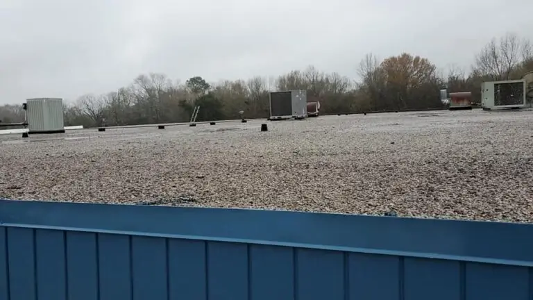 Look at this drastic change in a flat roof in Swainsboro. We took it from worn out gravel to a beautiful new TPO roof!